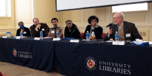 Panelists sitting at a table